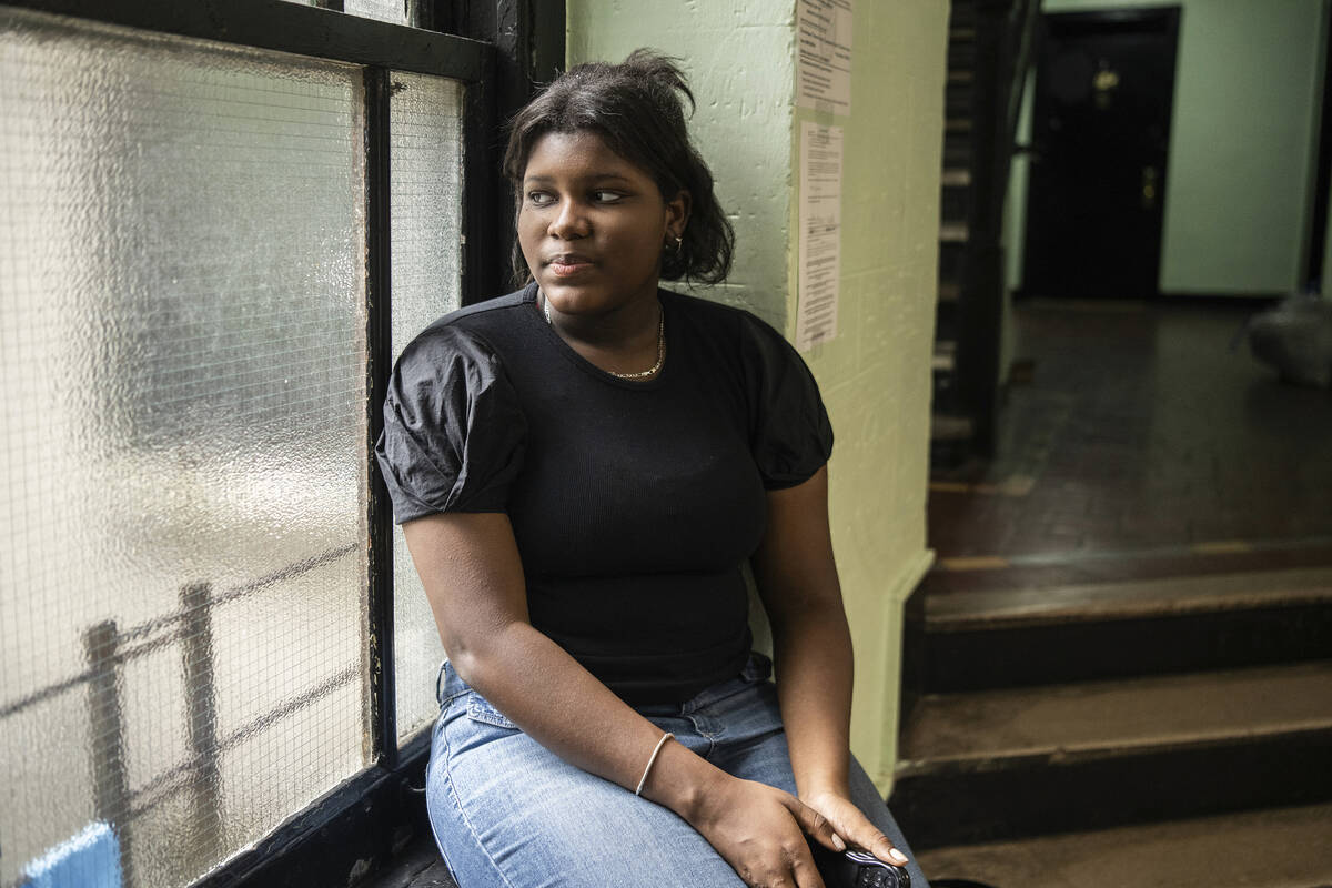 Mia Hall, 14, poses for a portrait in her neighborhood park on Thursday, Aug. 29, 2024, in Bron ...