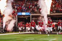 UNLV makes their entrance for the Mountain West championship game at Allegiant Stadium on Satur ...