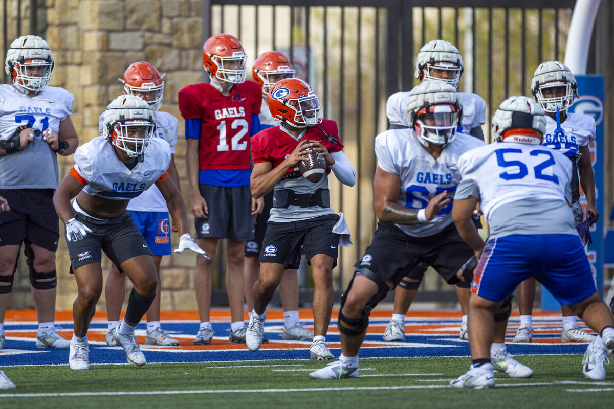 Bishop Gorman quarterback Melvin Spicer IV (#2) steps back in the pocket during football practi ...