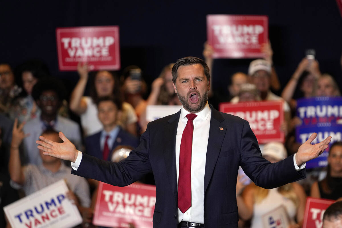 Republican vice presidential nominee Sen. JD Vance, R-Ohio, gestures to supporters at a campaig ...