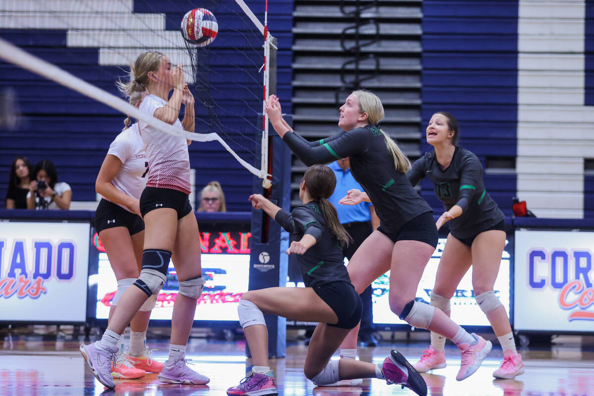 Palo Verde middle blocker Kate Camp (14) bumps the ball over the net during a volleyball match ...