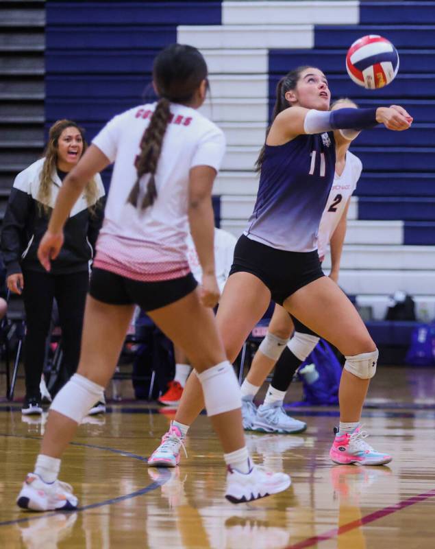 Coronado libero Reagan Vine (11) bumps the ball during a volleyball match between Coronado and ...