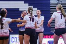 Coronado teammates celebrate winning a set during a volleyball match between Coronado and Palo ...