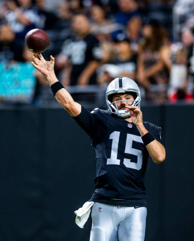 Raiders quarterback Gardner Minshew (15) gets off a pass as they face the Dallas Cowboys for th ...