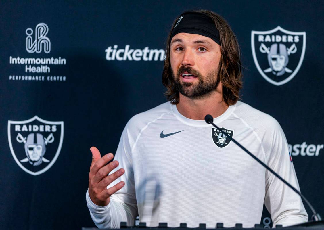 Raiders quarterback Gardner Minshew (15) answers a media question after practice at the Intermo ...