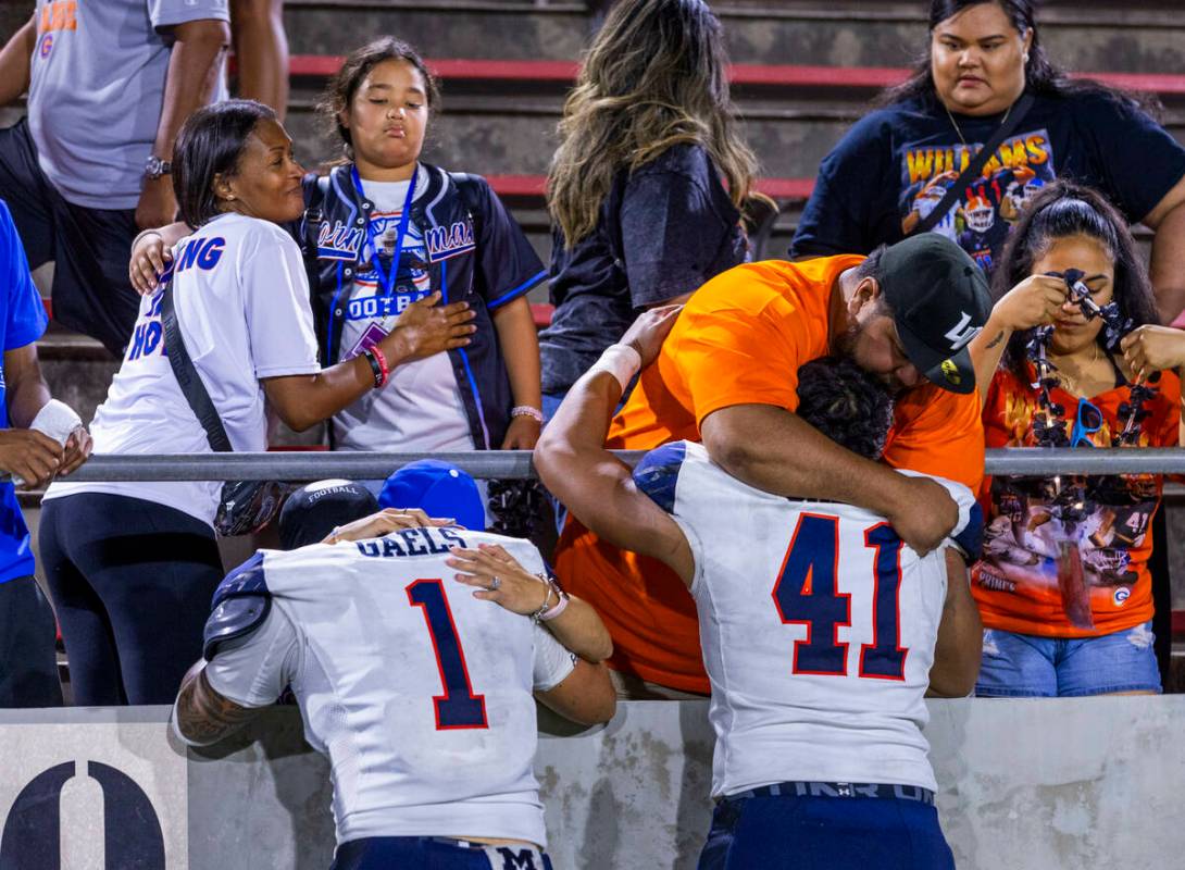 Bishop Gorman linebacker Champ Kapanui (1) and defensive lineman Prince Williams (41) are comfo ...