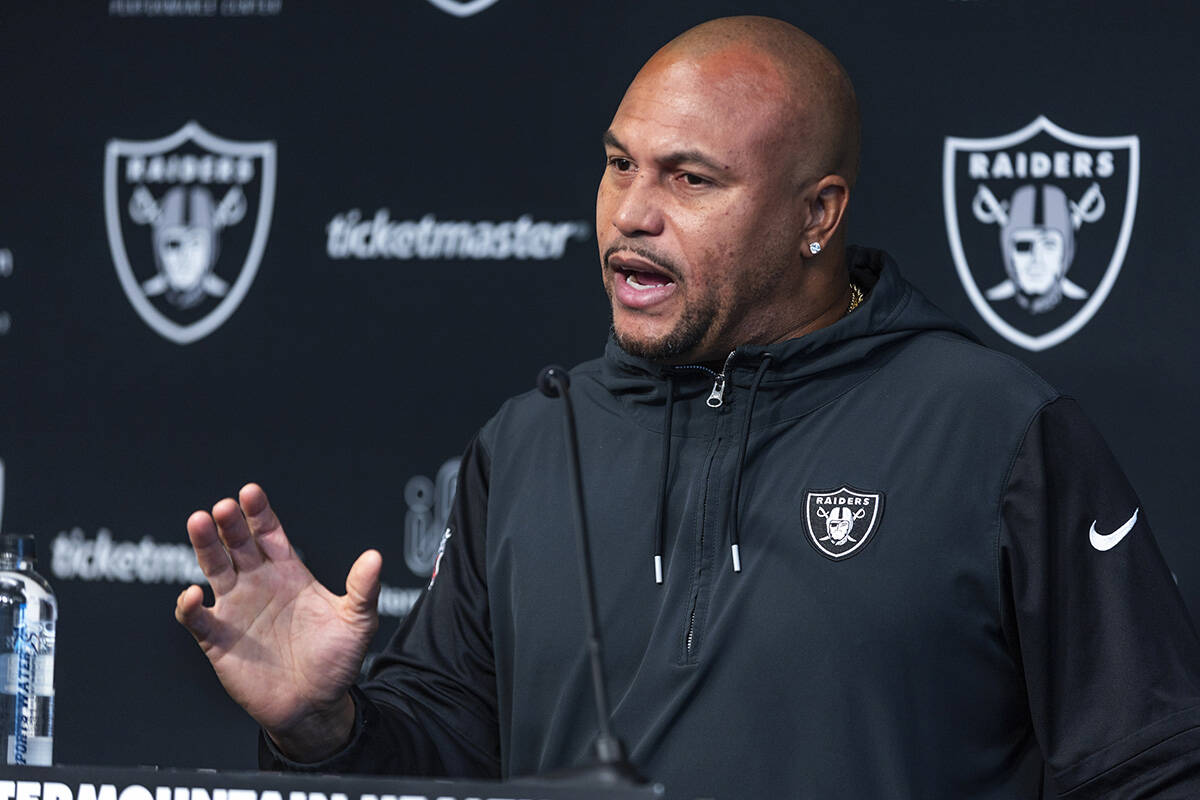 Raiders head coach Antonio Pierce answers a media question before practice at the Intermountain ...