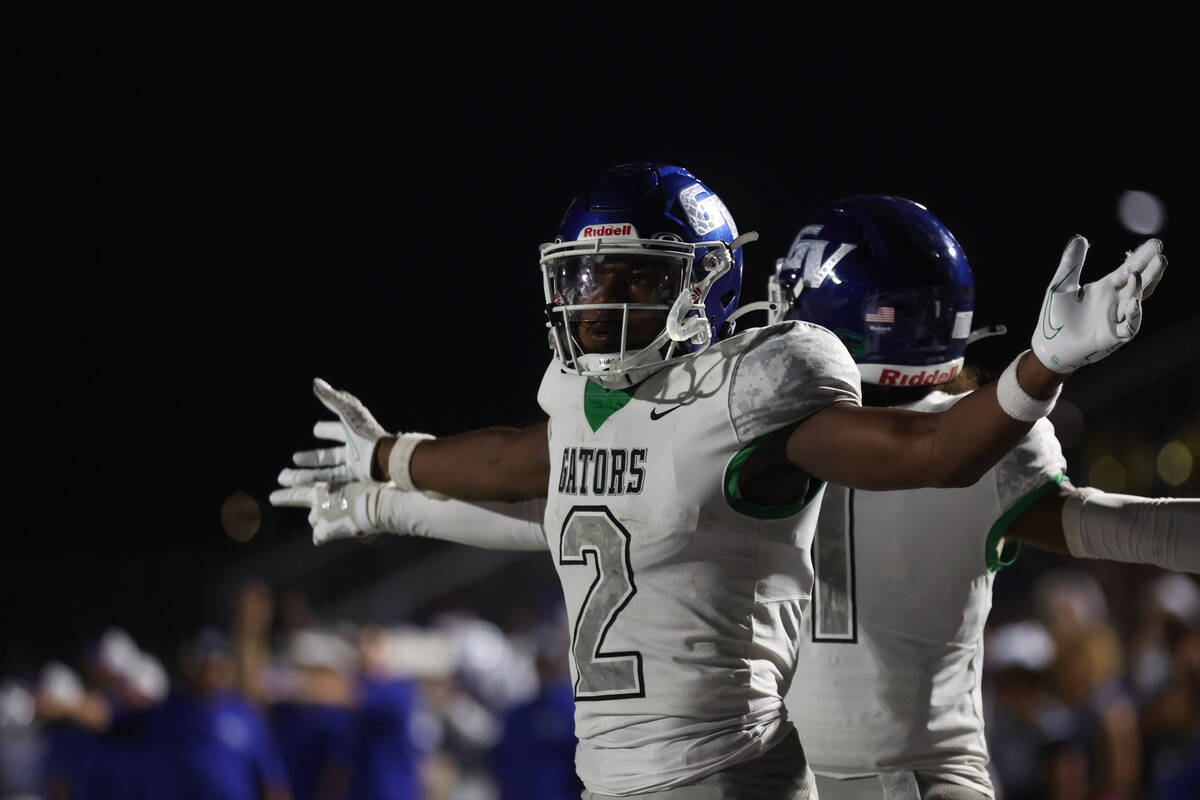 Green Valley’s Evan Williams (2) celebrates his touchdown during the second half of a hi ...