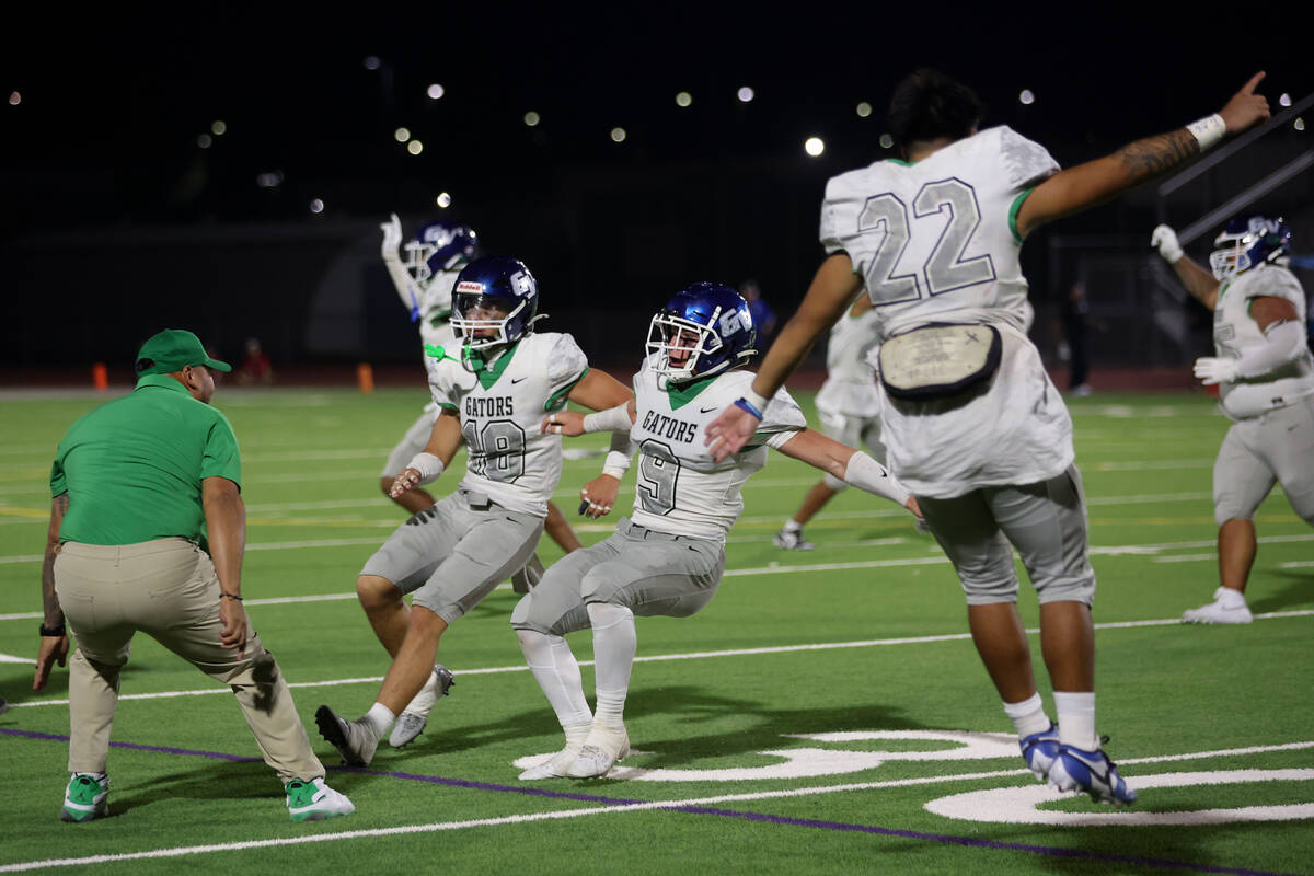 Green Valley runs into their bench as they win a high school football game against Basic at Bas ...