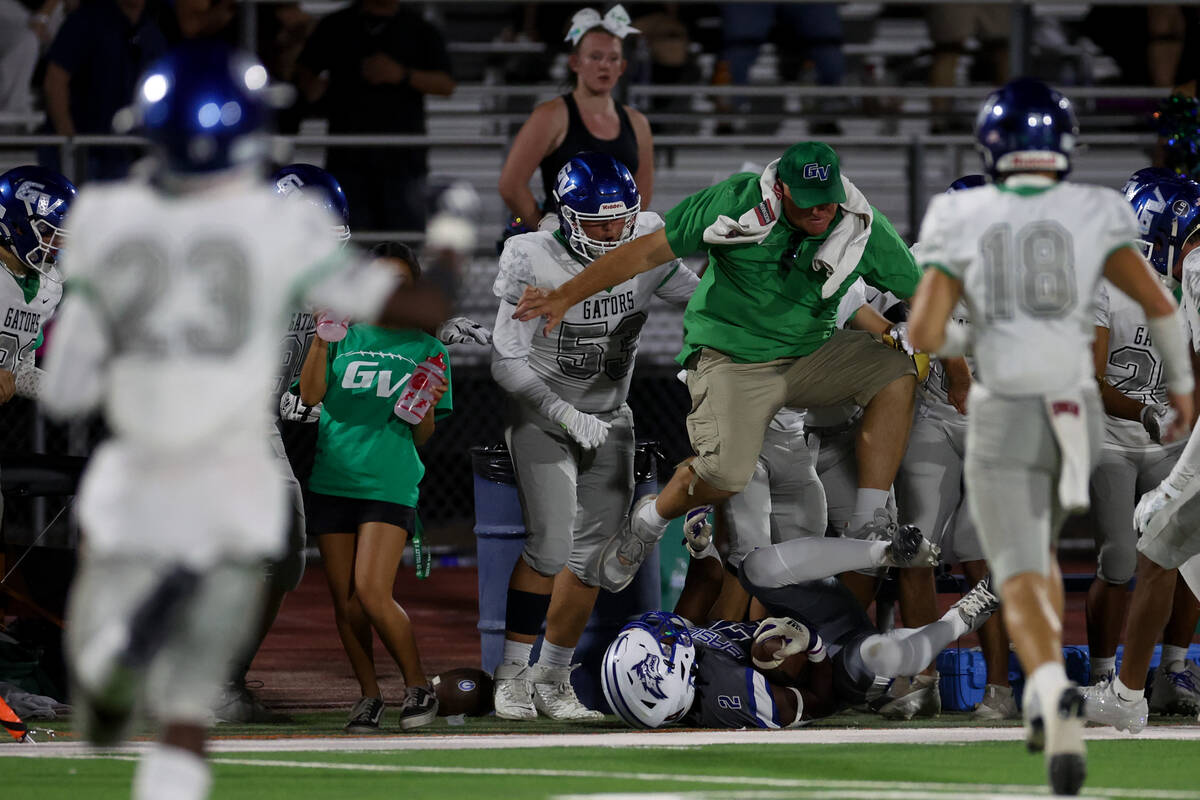 Basic’s Chrey Traylor (2) tumbles into the sidelines with a catch while Green Valley&#x2 ...