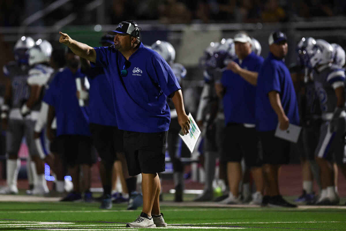 Basic head coach Jeff Cahill shouts from the sideline during the second half of a high school f ...