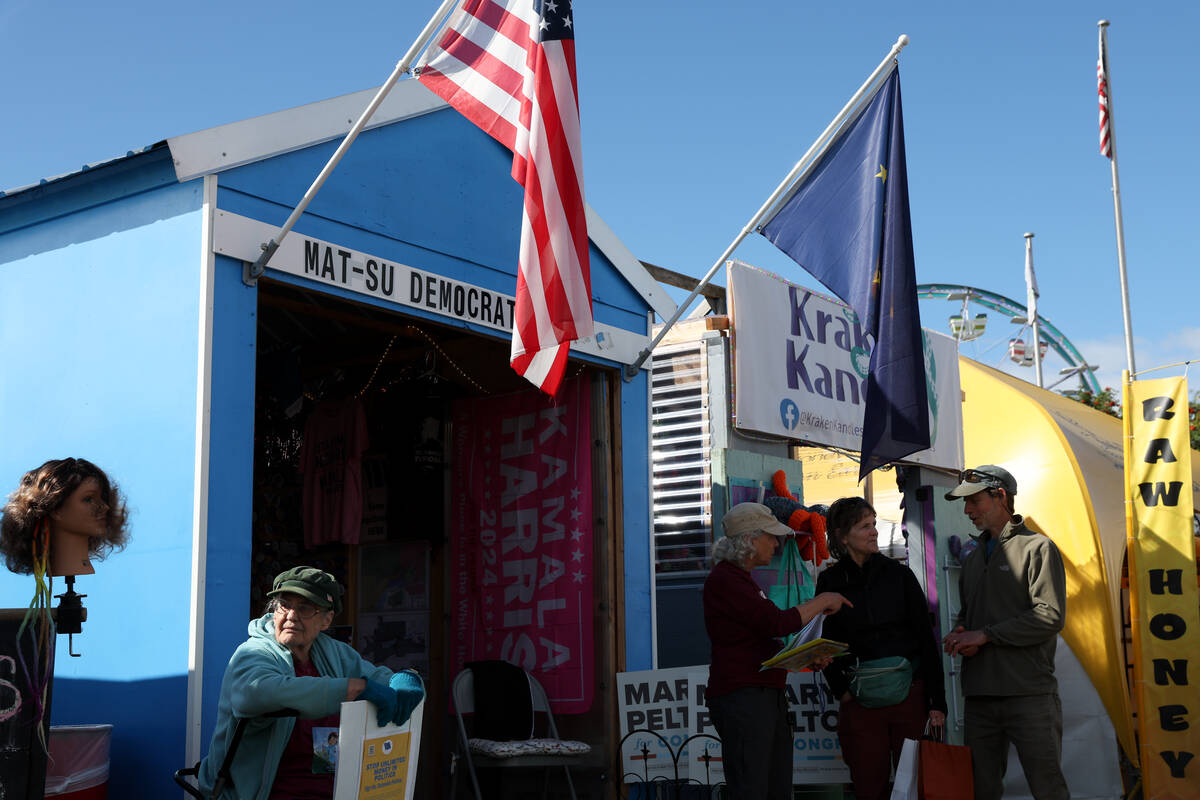 A booth for the Mat-Su Democrats welcomes fairgoers at the Alaska State Fair on Thursday, Aug. ...