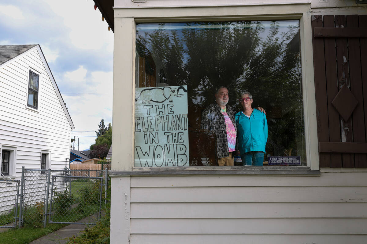 Local residents John Farleigh, who is an Independent voter, and Wendy Isbell, a Democrat, at t ...