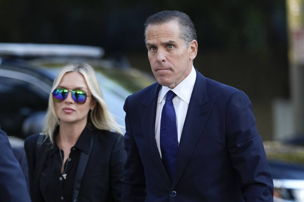 Hunter Biden, right, and his wife Melissa Cohen Biden, arrive in federal court for jury selecti ...