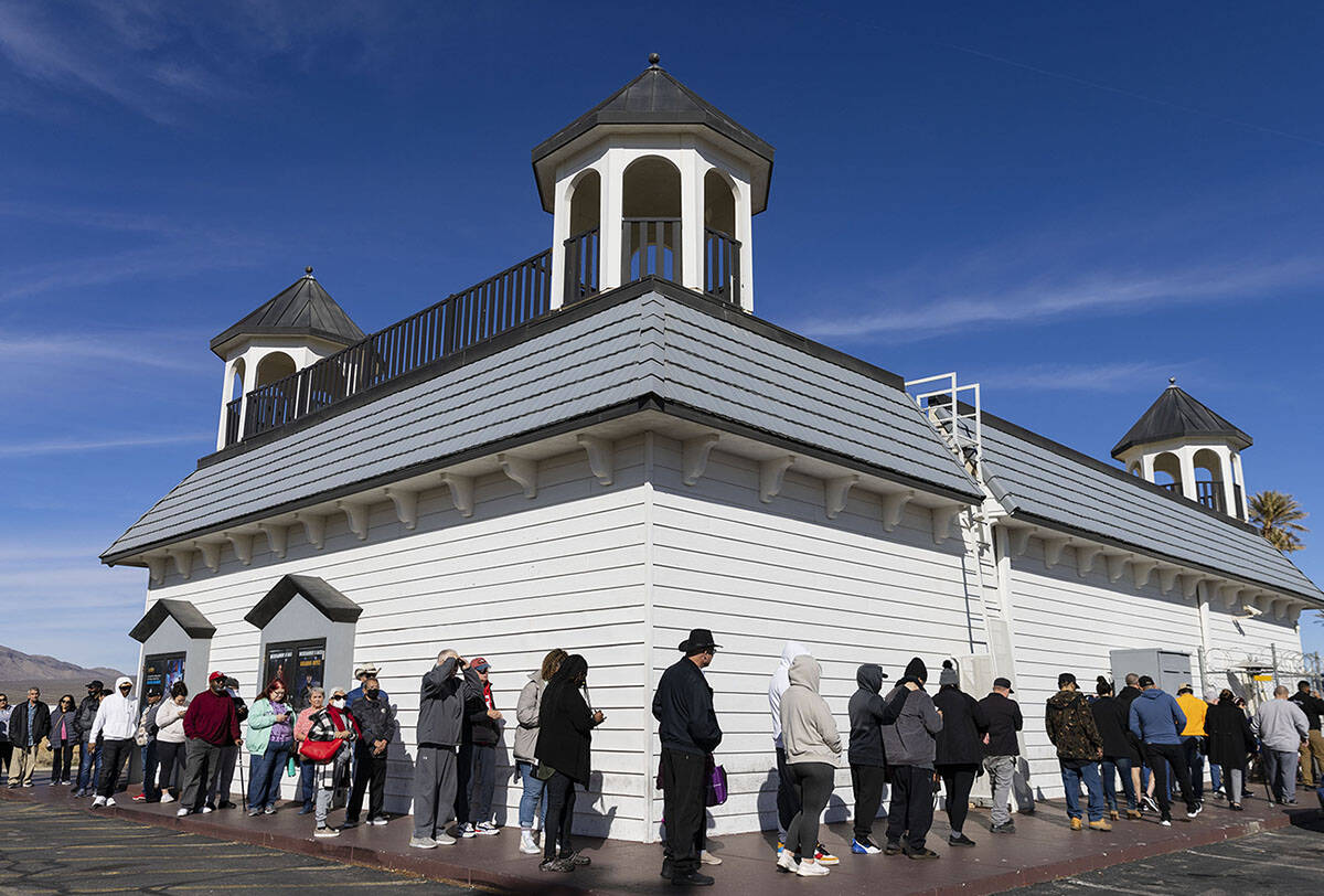 People wait in line to buy lottery tickets at The Lotto Store at Primm, just inside the Califor ...