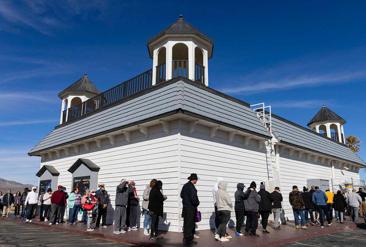 People wait in line to buy lottery tickets at The Lotto Store at Primm, just inside the Califor ...