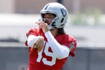 Raiders quarterbacks Gardner Minshew (15) watches his throw during practice at the Intermountai ...