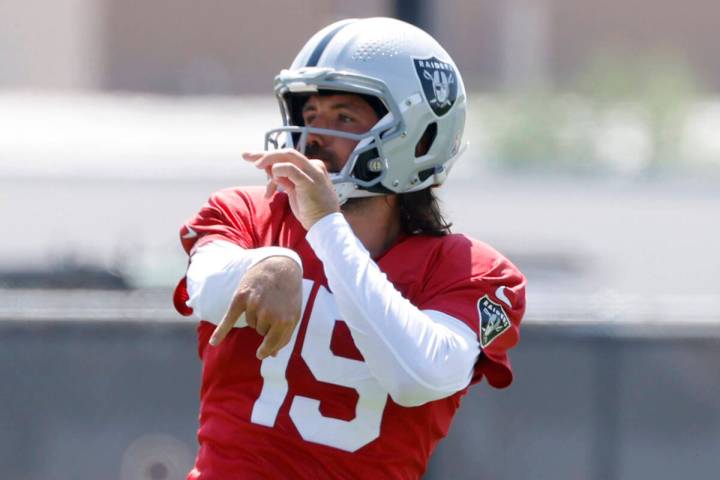 Raiders quarterbacks Gardner Minshew (15) watches his throw during practice at the Intermountai ...