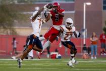 Legacy senior Dominic Oliver (1) steps in front of Arbor View wide receiver Damani Warren (3) f ...