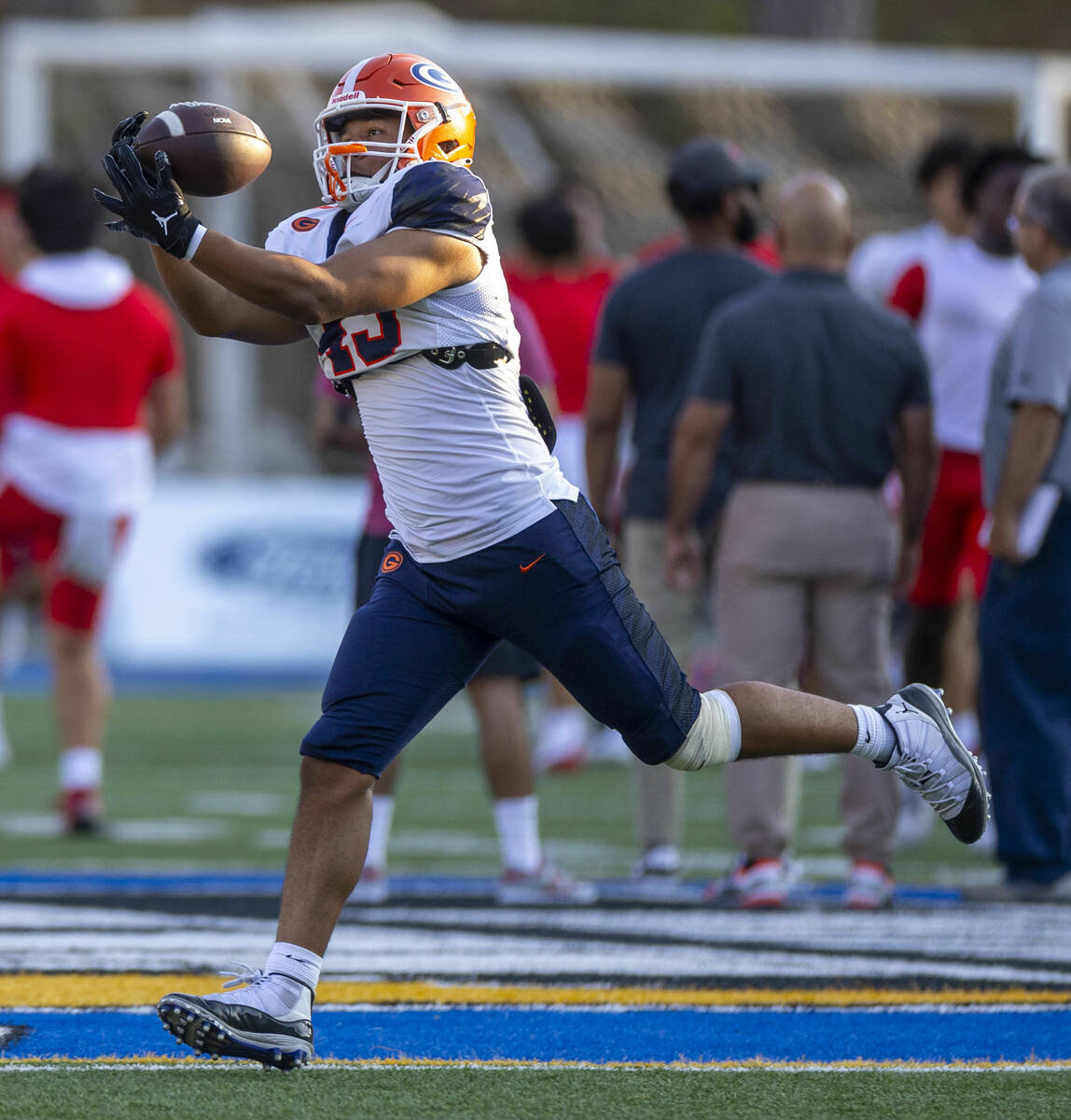 Bishop Gorman tight end Trent Walker (43) catches a pass as they warm up to face Mater Dei in t ...