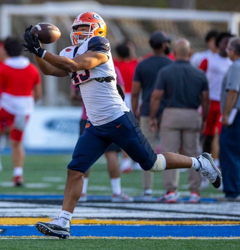 Bishop Gorman tight end Trent Walker (43) catches a pass as they warm up to face Mater Dei in t ...