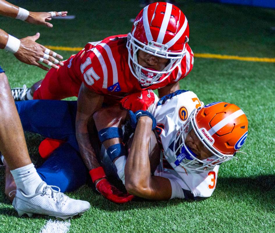 Bishop Gorman cornerback Hayden Stepp (32) comes down with the ball though Mater Dei wide recei ...