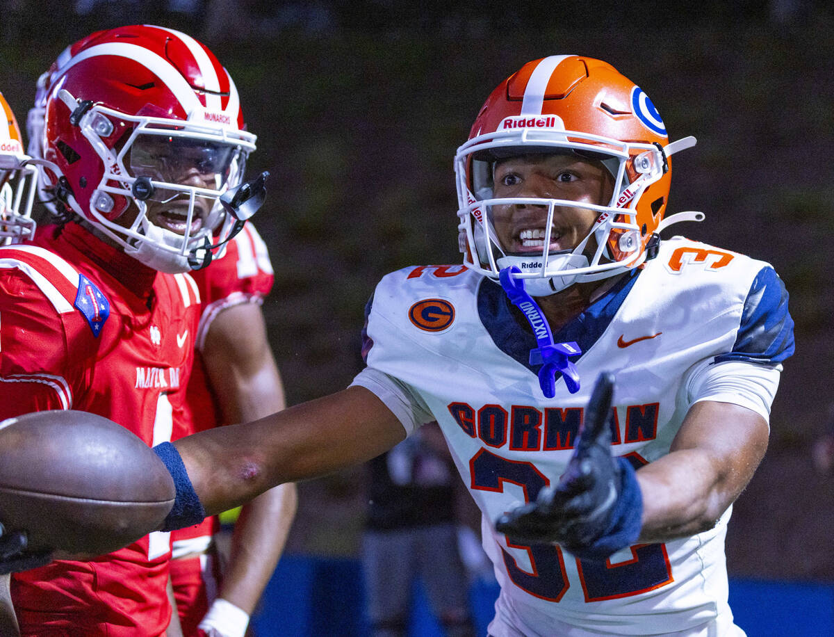 Bishop Gorman cornerback Hayden Stepp (32) argues he came away with the ball though Mater Dei w ...