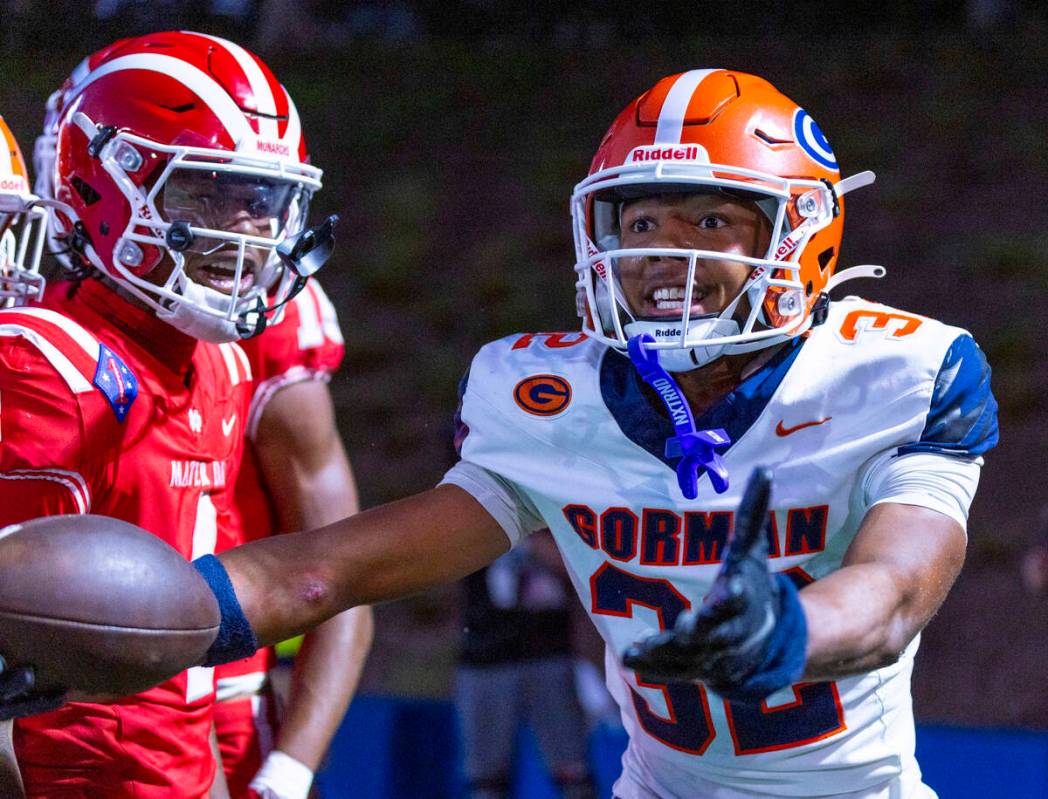 Bishop Gorman cornerback Hayden Stepp (32) argues he came away with the ball though Mater Dei w ...