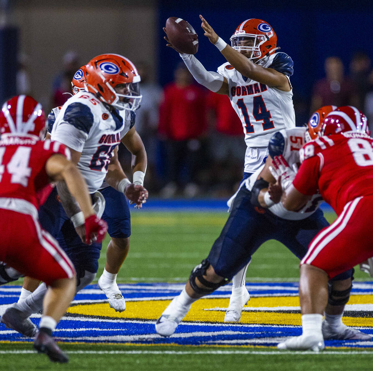 Bishop Gorman quarterback Maika Eugenio (14) lreaches for an errant snap against Mater Dei duri ...