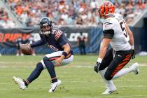 Chicago Bears quarterback Caleb Williams (18) runs with the ball during the first half of an NF ...