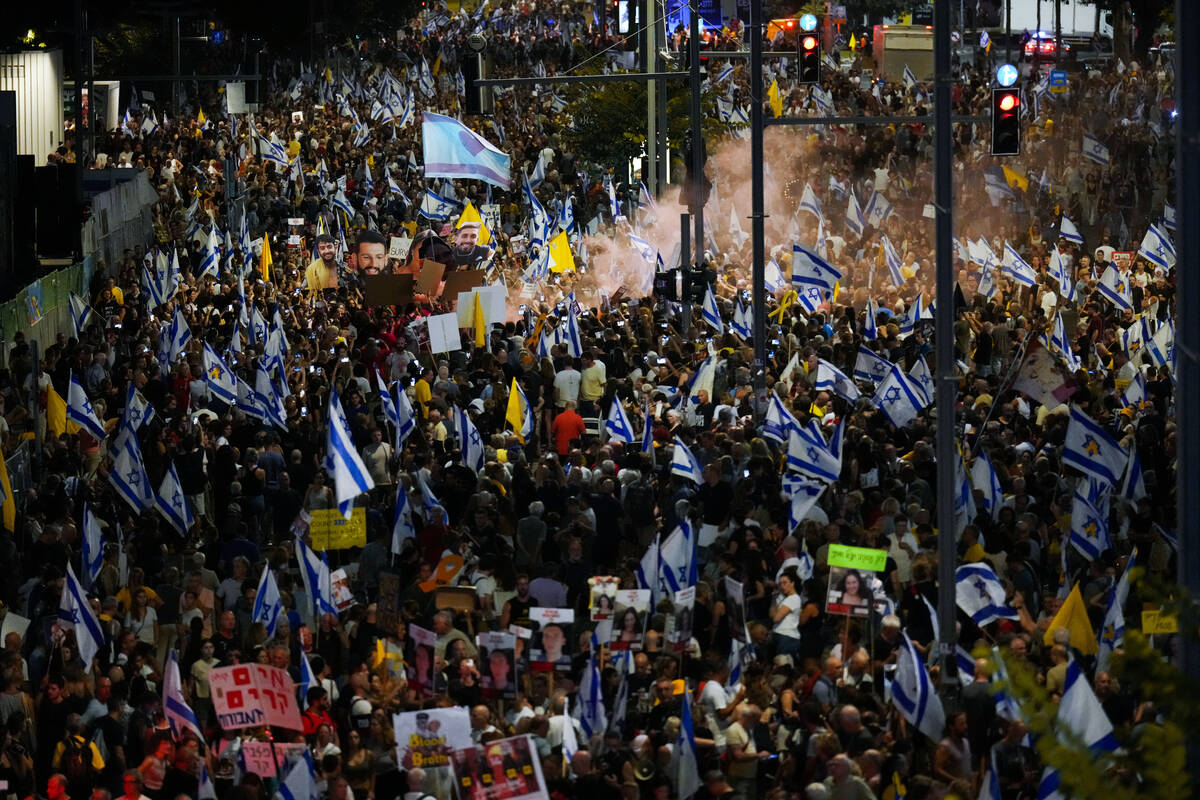 People protest against Prime Minister Benjamin Netanyahu's government and call for the release ...