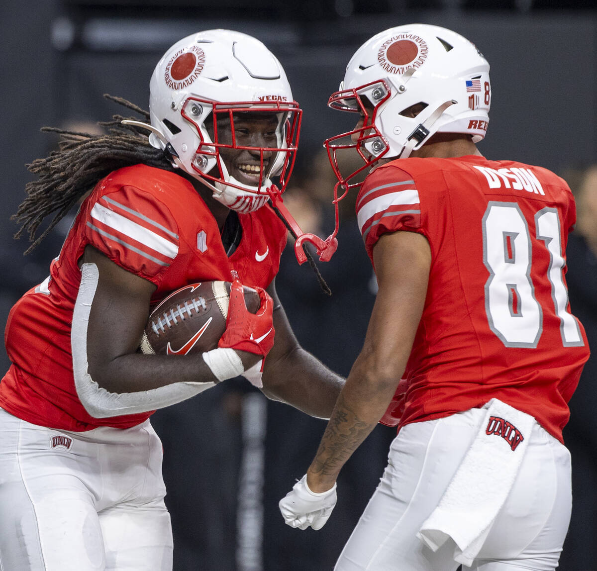 UNLV running back Devin Green (22) celebrates his touchdown with wide receiver Traivon Dyson (8 ...