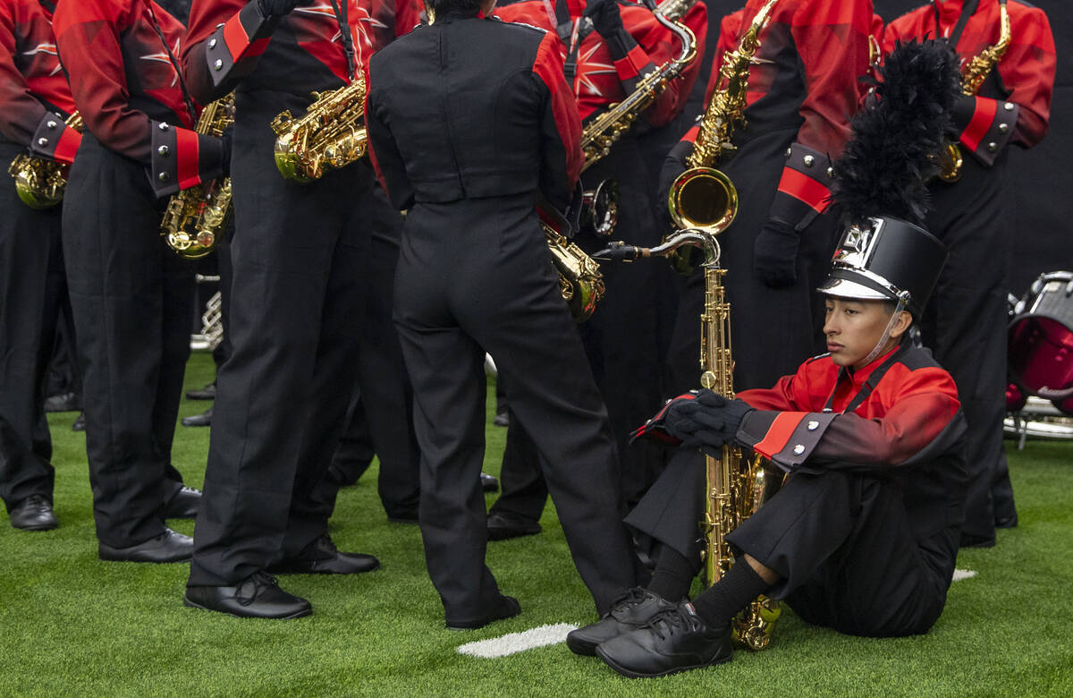 Members of the UNLV Star of Nevada Marching Band wait to take the field before halftime during ...