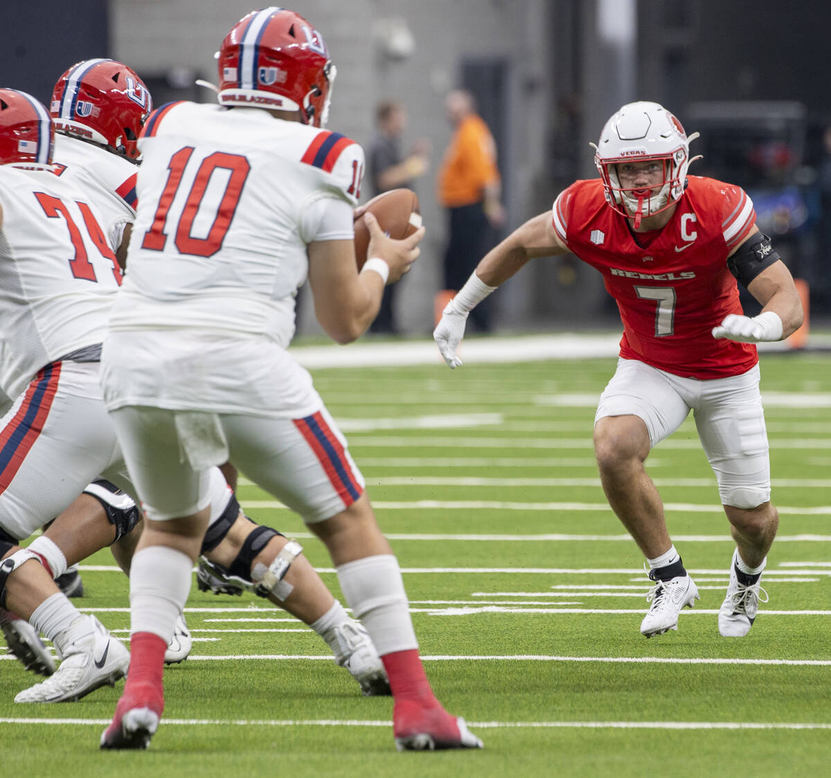 UNLV linebacker Jackson Woodard (7) runs toward Utah Tech quarterback Deacon Hill (10) during t ...