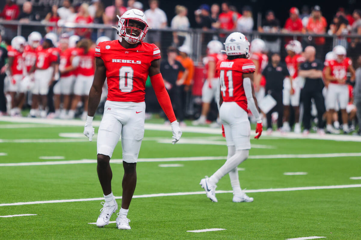 UNLV defensive back Tony Grimes (0) giggles after Utah Tech received a flag on a play during an ...