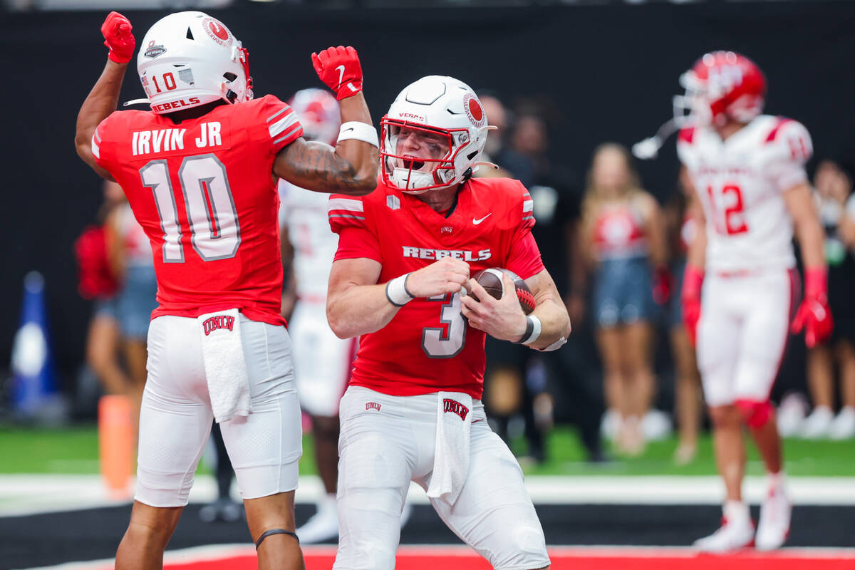 UNLV quarterback Matthew Sluka (3) celebrates a touchdown with wide receiver DeAngelo Irvin Jr. ...