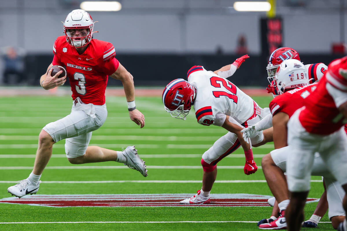 UNLV quarterback Matthew Sluka (3) draws the ball during an NCAA football game between UNLV and ...