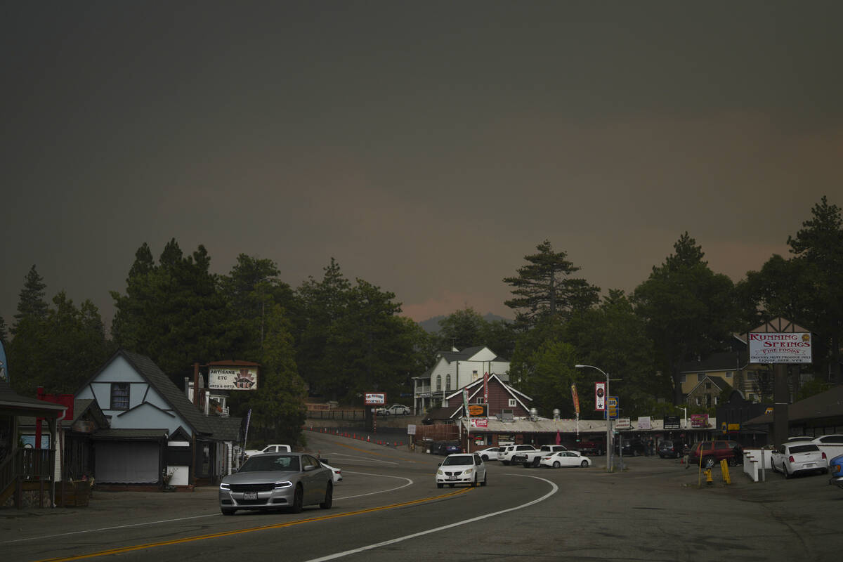 Smoke from the Line Fire fills the air Saturday, Sept. 7, 2024, in Running Springs, Calif. (AP ...