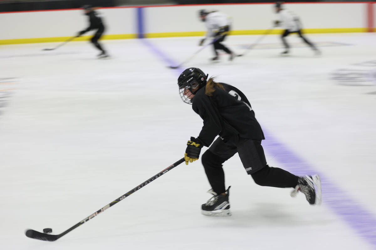 Vegas Jr. Golden Knights 14U Girls team players skate during practice at America First Center o ...