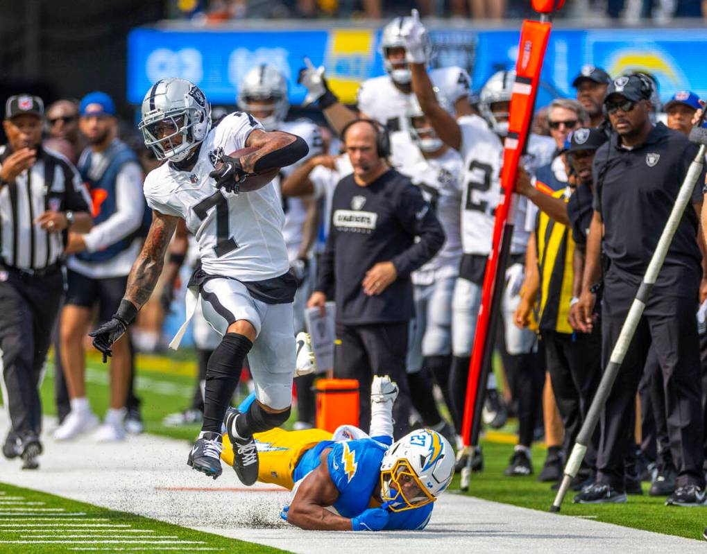 Raiders safety Tre'von Moehrig (7) sprints down the sidelines with a misses tackle by Los Angel ...