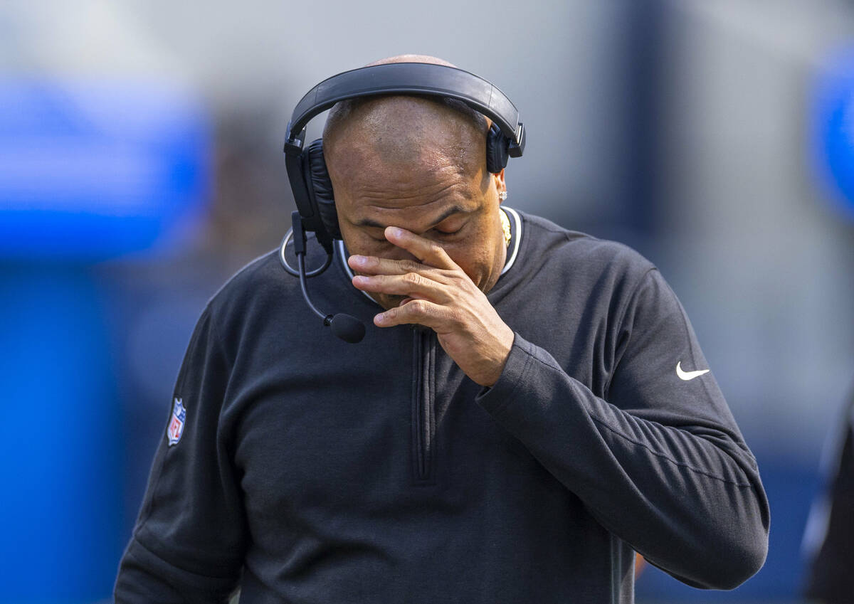 Raiders head coach Antonio Pierce walks dejected on the sidelines after a late failed drive dur ...