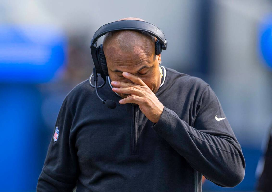 Raiders head coach Antonio Pierce walks dejected on the sidelines after a late failed drive dur ...