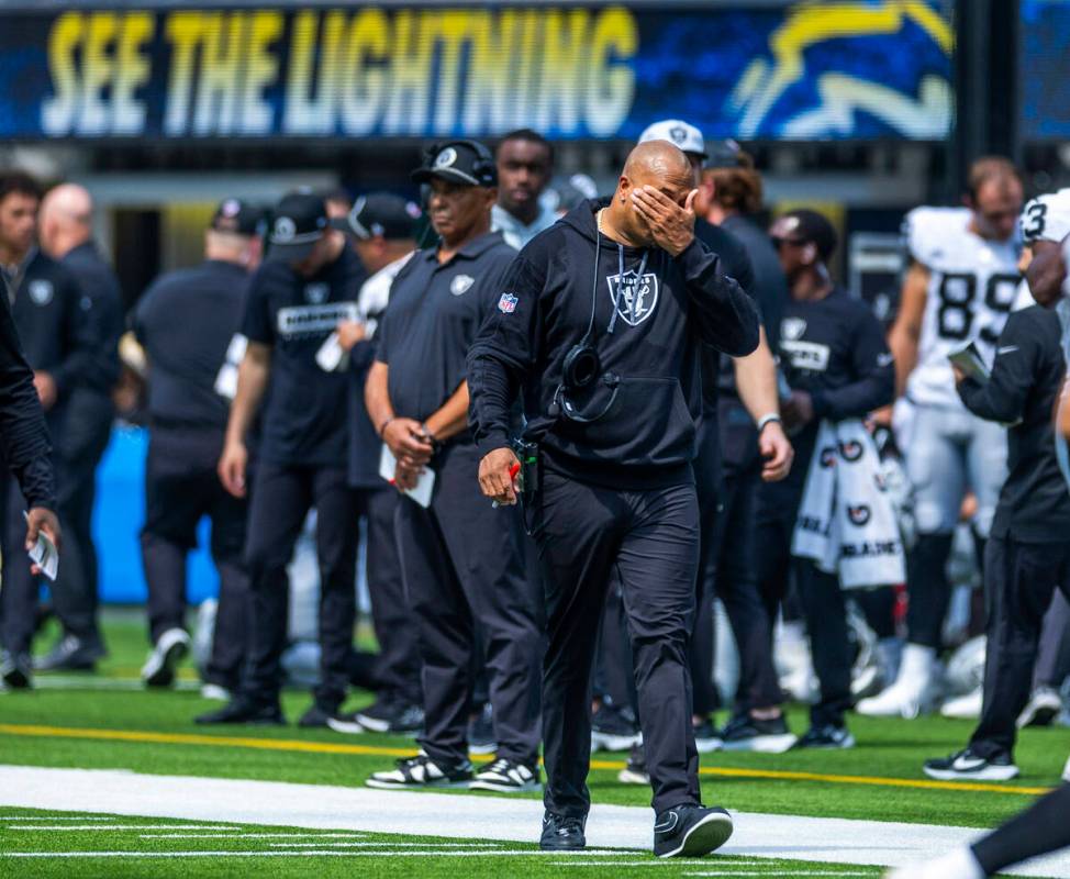 Raiders head coach Antonio Pierce walks dejected on the sidelines after another stalled drive a ...