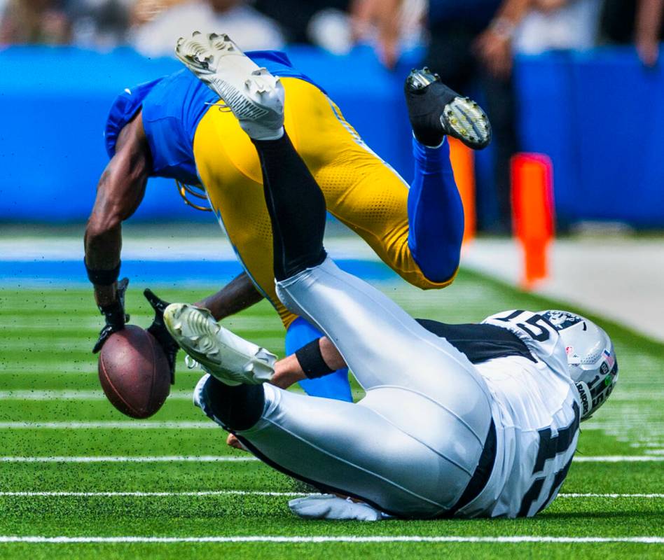 Los Angeles Chargers cornerback Kristian Fulton (7) works to scoop up a lateral that got away f ...