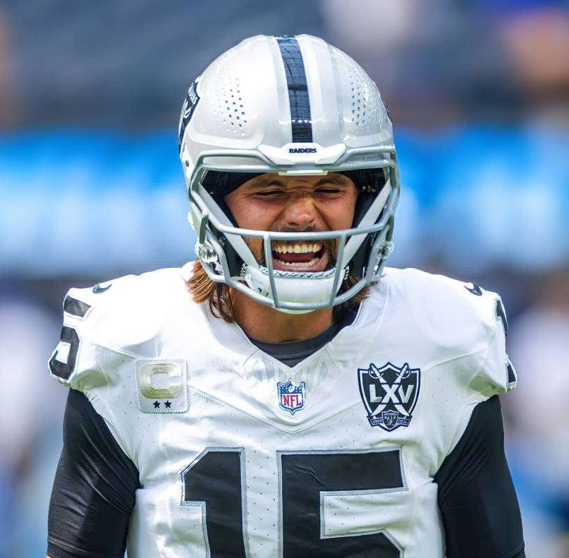 Raiders quarterback Gardner Minshew (15) yells out on the field against the Los Angeles Charger ...