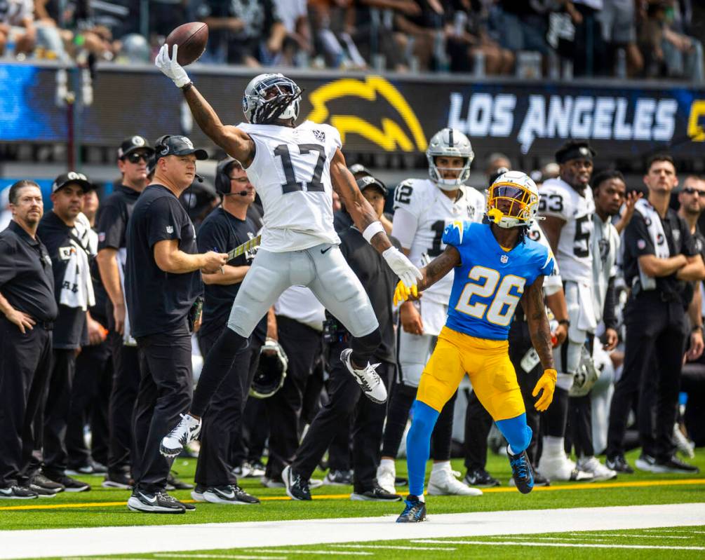 Raiders wide receiver Davante Adams (17) elevates for a one-handed catch as Los Angeles Charger ...