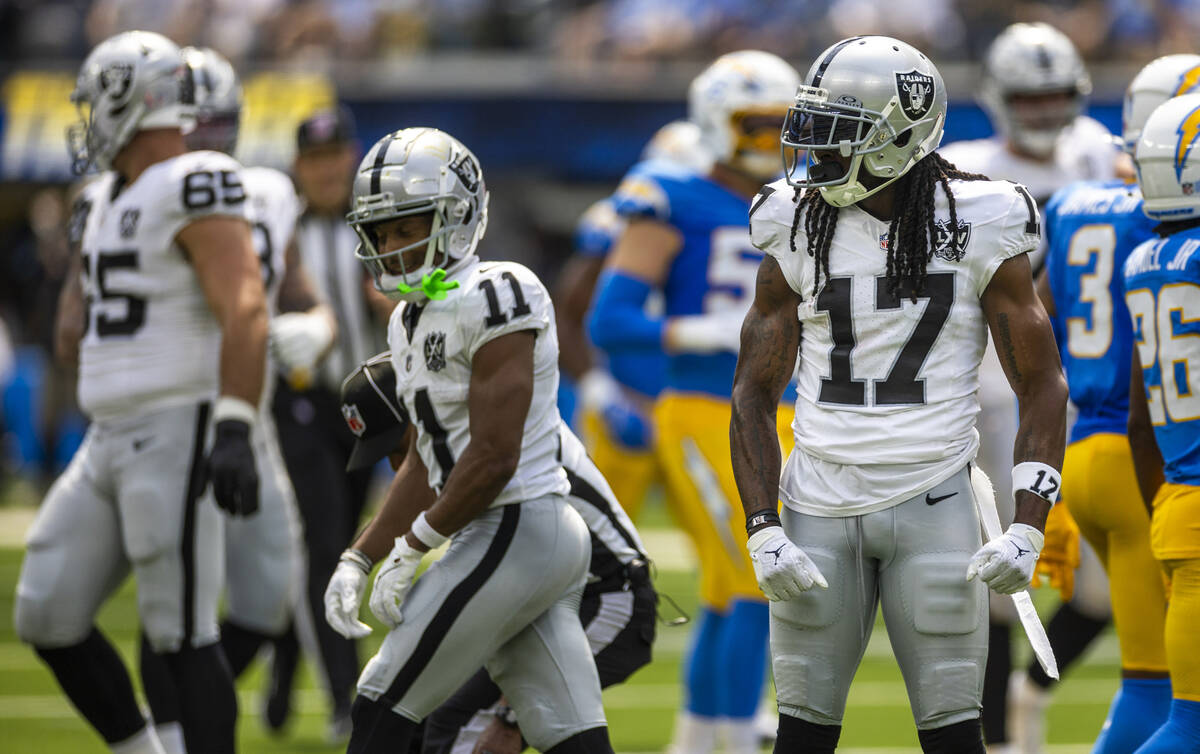 Raiders wide receiver Davante Adams (17) poses on the field after a catch and run against the L ...