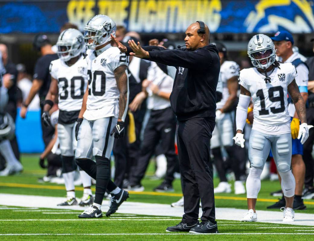 Raiders head coach Antonio Pierce signals his team against the Los Angeles Chargers during the ...