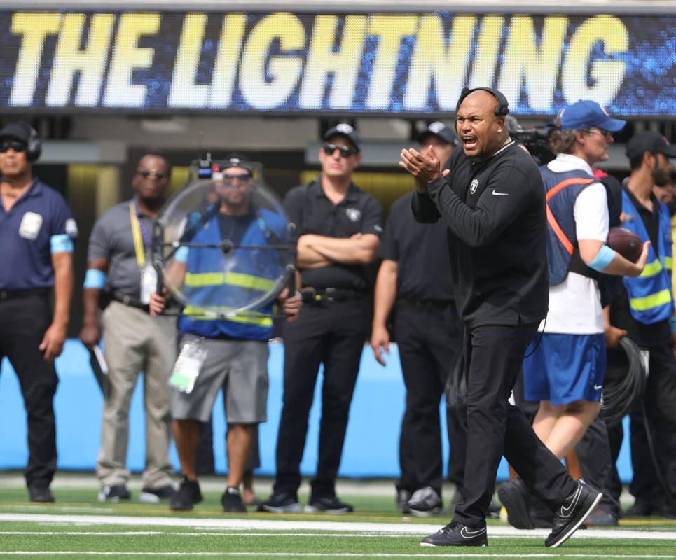 Raiders head coach Antonio Pierce cheers the team on during the second half of an NFL game agai ...