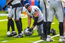 Raiders linebacker Robert Spillane (41) is spent on the field as the game nears and end against ...